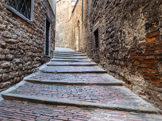 stone steps on narrow medieval street in Bergamo