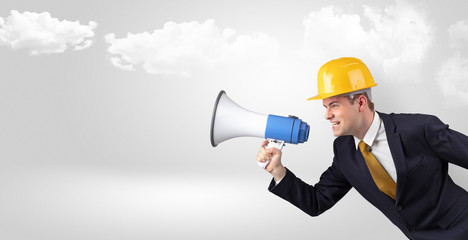 Fototapeta premium Young supervisor architect yelling to far big city panorama 