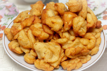 A large plate of delicious and fragrant donuts