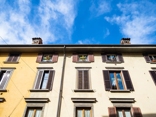 Fototapeta na wymiar apartment house under blue sky in Bergamo city