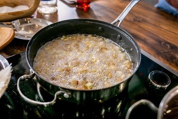 Vegetables in a pan in the process of stewing. Master class in the kitchen. The process of cooking. Step by step. Tutorial. Close-up