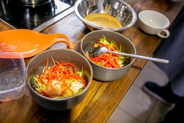 Billet of chopped vegetables in bowls. Master class in the kitchen. The process of cooking. Step by step. Tutorial. Close-up