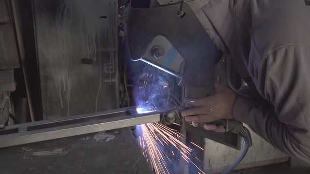 Man welding steel frame