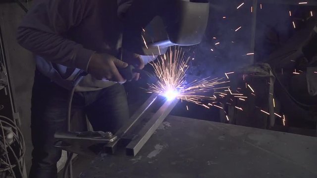 Man welding steel frame