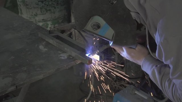 Man welding steel frame
