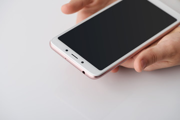 Smartphone in the hands of the girl.