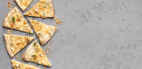 Four cheese pizza cutted into slices, top view