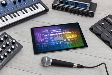 Electronic music instruments, microphone, piano, consoles and tablet with reports concept
