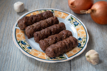 Barbeque Kebab, traditional middle eastern and mediterranean eat from minced meat on the grill with salad
