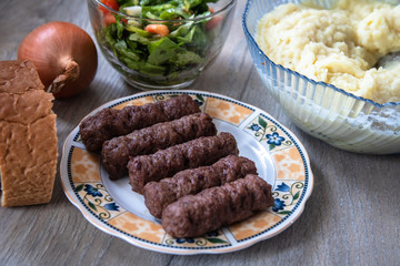 Barbeque Kebab, traditional middle eastern and mediterranean eat from minced meat on the grill with salad