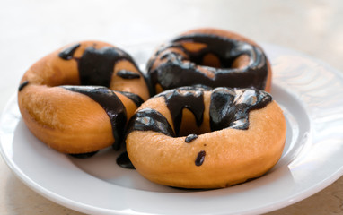 donuts isolated on white plate