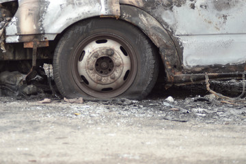 Fototapeta na wymiar Burnt out vehicle abandoned