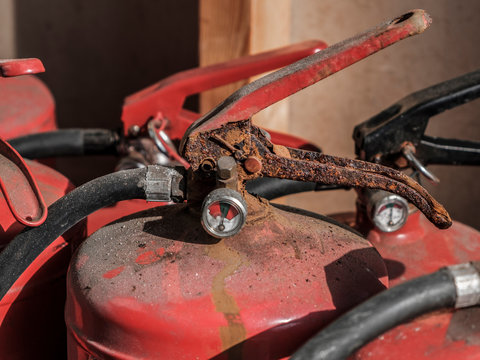 An aold rusty fire extinguisher