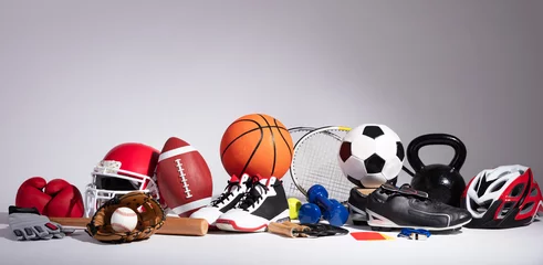 Zelfklevend Fotobehang Close-up Of Sport Balls And Equipment © Andrey Popov
