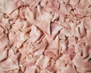 Food tray with sliced ham meat, top view, close-up