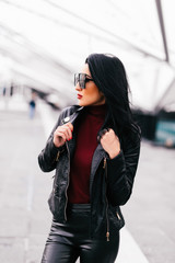 Fototapeta premium Young pretty girl walk on the street wear sunglasses, sunny day weather