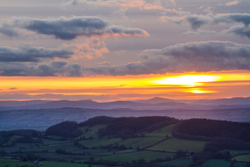 Fototapeta na wymiar Sunset over Herefordshire seen from Malvern Hills