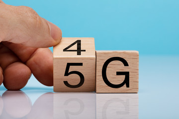 Hand Changing Wooden Block From 4g To 5g