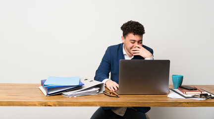 Business man in a office smiling a lot