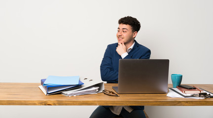 Business man in a office looking to the side