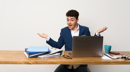 Business man in a office holding copyspace with two hands