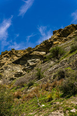 Fototapeta na wymiar rocky steep mountain hill, sunny warm day