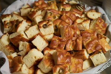 Baked olives bread food in basket, close-up. Olive Rosemary Bread
