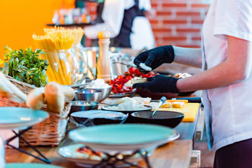 catering food on the table, waiter with catering food