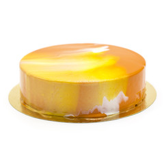 orange souffle cake on a white plate with berries