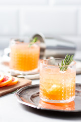 Cocktail with grapefruit juice and rosemary