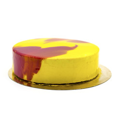 yellow cake with strawberry souffle on a white plate with berries