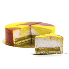 yellow cake with strawberry souffle on a white plate with berries