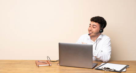 Telemarketer man pointing finger to the side