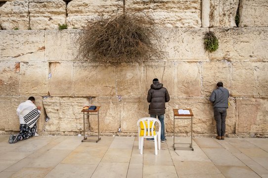 JERUSALEM, ISRAEL. February 15, 2019. Jewish people praying at the Western Wall aka Wailing wall in the old city of Jerusalem. Jewish prayer concept.