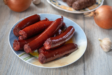 Grilled traditional homemade smoked sausage with salad and mashed potato