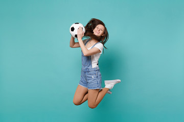 Funny woman football fan cheer up support favorite team holding soccer ball jumping isolated on...
