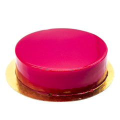 pink raspberry cake with raspberry jam on a white plate