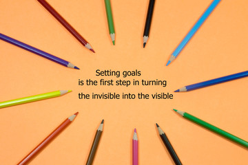 The text Setting goals is the first step in turning the invisible into the visible 
