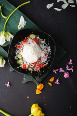 Top view, Fresh vegetables salad with tomatoes, cheese cucumber, papper, on dark plate