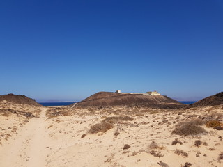 Fototapeta na wymiar Landscape with lignhouse on Isla de Lobos near Fuerteventura