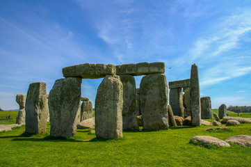 Travel England, United Kingdom. Popular tourist destination in Europe. The ancient monument, famous, mysterious Stonehenge attraction. Sunny day, blue sky. Travel/outdoor background.