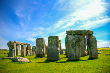 Naklejka premium Travel England, United Kingdom. Popular tourist destination in Europe. The ancient monument, famous, mysterious Stonehenge attraction. Sunny day, blue sky. Travel/outdoor background.