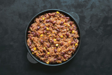 Quinoa red bean chili on black table. 