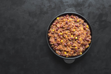 Quinoa red bean chili on black table. 
