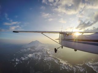Fototapeta premium Mountain Flying across the beautiful North American Landscape. Located at Mount Baker, Northeast of Seattle, Washington, USA.