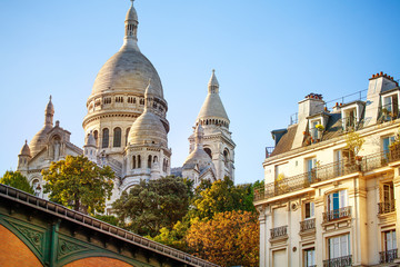 Sacre Coeur cathedral over classical Paris house - obrazy, fototapety, plakaty