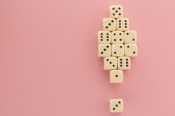 White gaming dices on pink background. victory chance, lucky. Flat lay, place for text. Top view. Close-up. Concept gamble. spectacular pastel