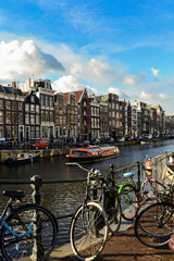 Fototapeta premium Traditional old buildings and and boats in Amsterdam, Netherland
