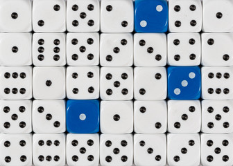 Background of random ordered white dices with three blue cubes
