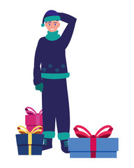 boy with winter clothes and christmas gifts